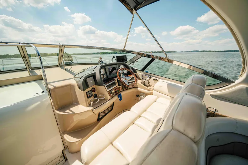 Slide: The Image of 2006 Four Winns 348 Vista boat cockpit with leather seating and scenic water view. - 30