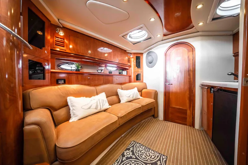 Slide: The Image of Luxurious interior of 2006 Four Winns 348 Vista yacht with plush seating and elegant wood finishes. - 40