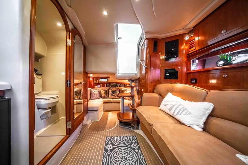 Slide: The Image of Luxurious interior of 2006 Four Winns 348 Vista yacht with cozy seating and elegant wood finishes. - 45