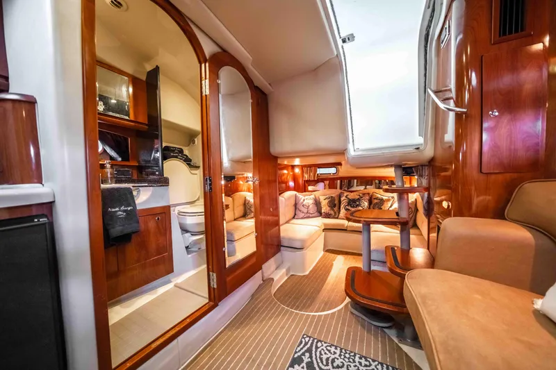 Slide: The Image of Luxurious interior of 2006 Four Winns 348 Vista yacht with cozy seating and elegant wood finishes. - 46