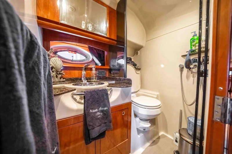 Slide: The Image of Luxurious bathroom in 2006 Four Winns 348 Vista yacht with elegant fixtures and wood accents. - 47