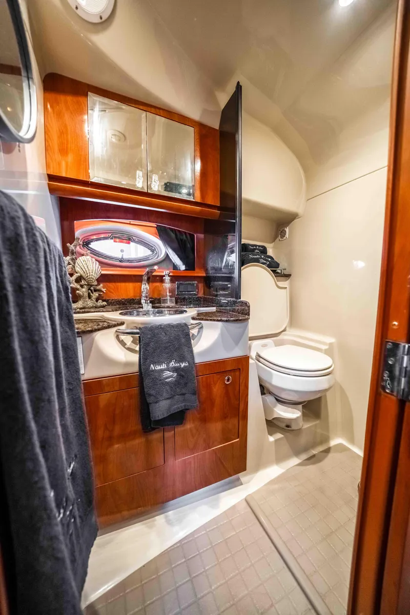 Slide: The Image of Luxurious 2006 Four Winns 348 Vista yacht bathroom with elegant wood cabinetry and modern fixtures. - 48