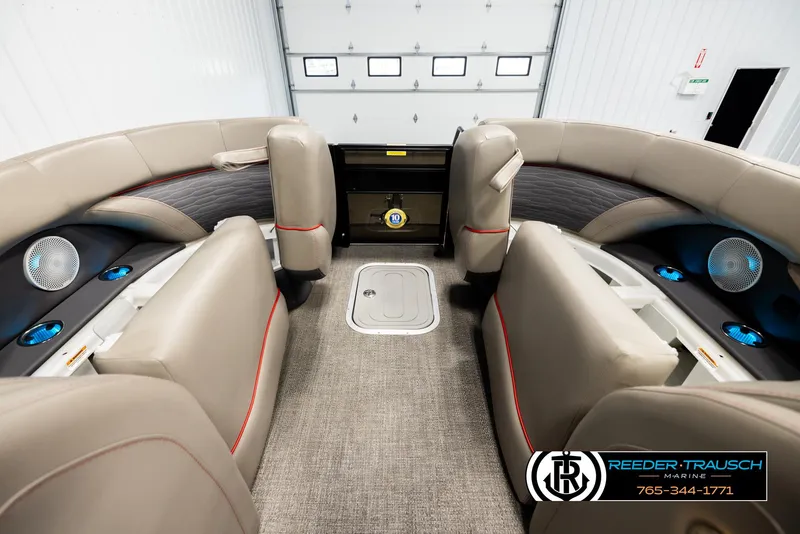 Slide: The Image of Interior of 2023 Barletta 21 UC boat with beige seating and blue-lit speakers. - 19