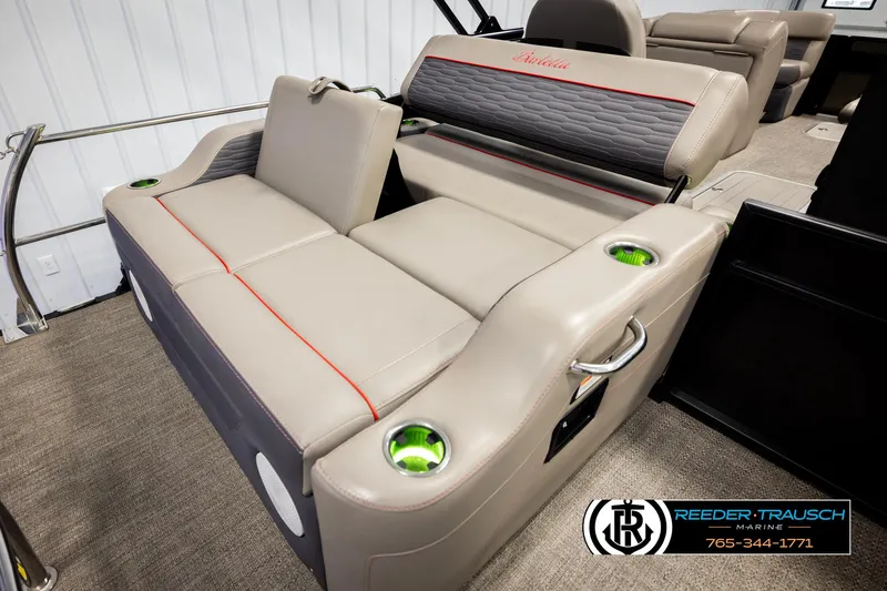 Slide: The Image of 2023 Barletta 21 UC boat interior with beige seating and cup holders. - 26