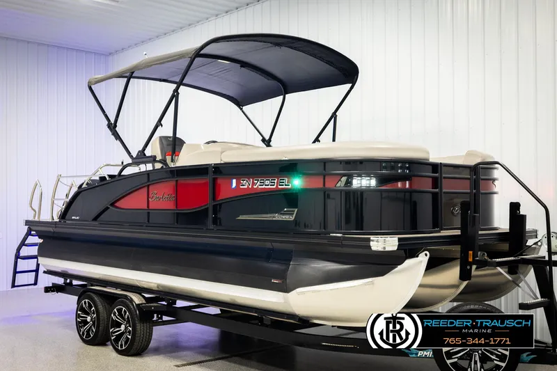 Slide: The Image of 2023 Barletta 21 UC pontoon boat with canopy in showroom. - 3