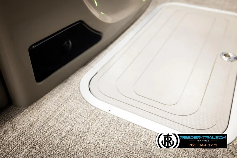 Slide: The Image of 2023 Barletta 21 UC boat interior with textured flooring and storage compartment. - 32