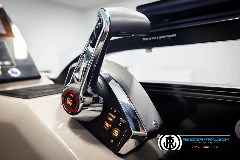 Slide: The Image of 2023 Barletta 21 UC boat throttle control with start/stop button, Reeder-Trausch Marine branding. - 45
