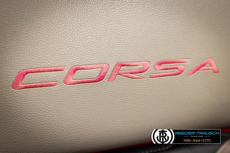 Slide: The Image of 2023 Barletta 21 UC Corsa logo on beige leather upholstery, Reeder-Trausch Marine branding. - 49