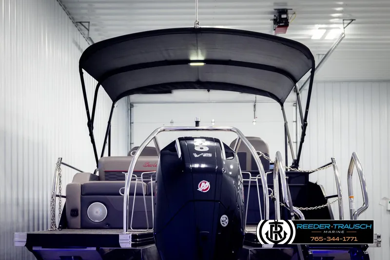 Slide: The Image of 2023 Barletta 21 UC pontoon boat with canopy in a showroom. - 7