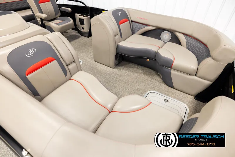 Slide: The Image of 2023 Barletta 21 UC boat interior with beige and gray seating, red accents. - 9