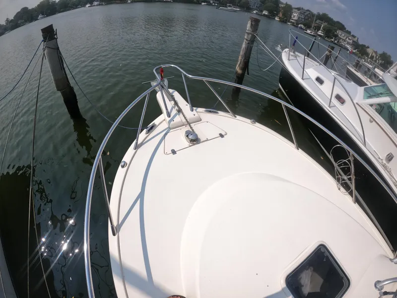 Slide: The Image of 2010 Scout 262 Abaco boat docked on calm water. - 6