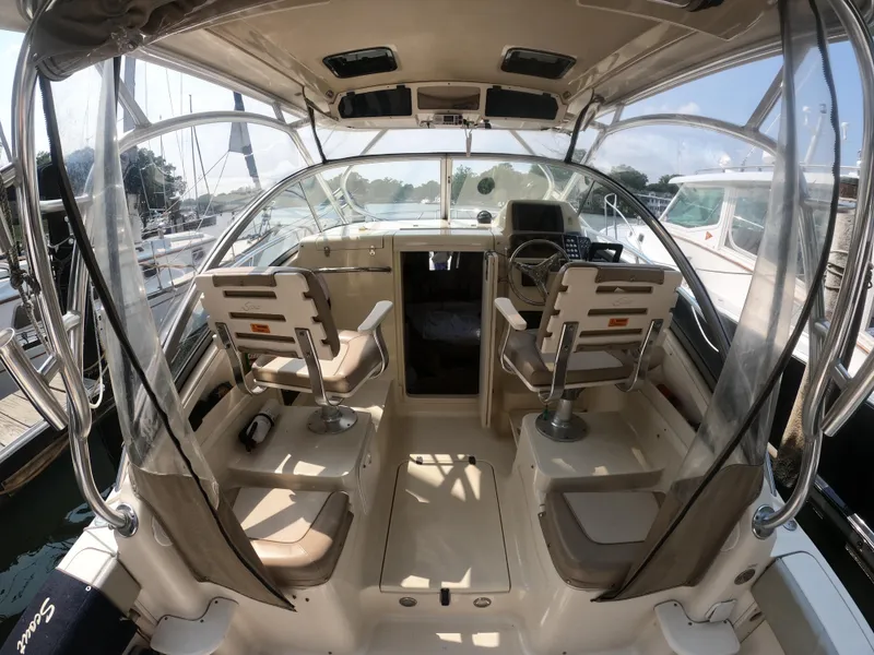 Slide: The Image of Interior of 2010 Scout 262 Abaco boat with seating and steering wheel. - 9