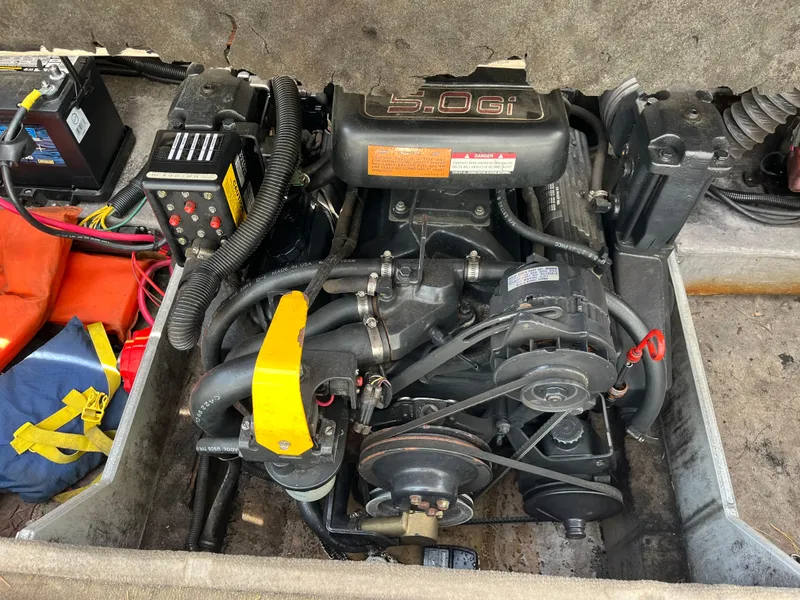 Slide: The Image of Engine compartment of a 1999 Chaparral 1930 SS boat, featuring a 5.0 GI engine. - 10