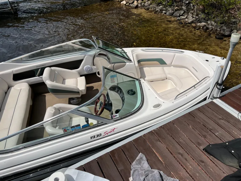 Slide: The Image of Chaparral 1930 SS 1999 boat docked, featuring white interior and sleek design. - 2