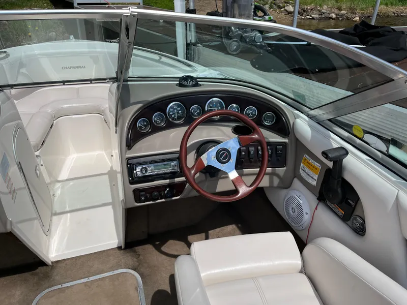Slide: The Image of Interior of a 1999 Chaparral 1930 SS boat with steering wheel and dashboard controls. - 3
