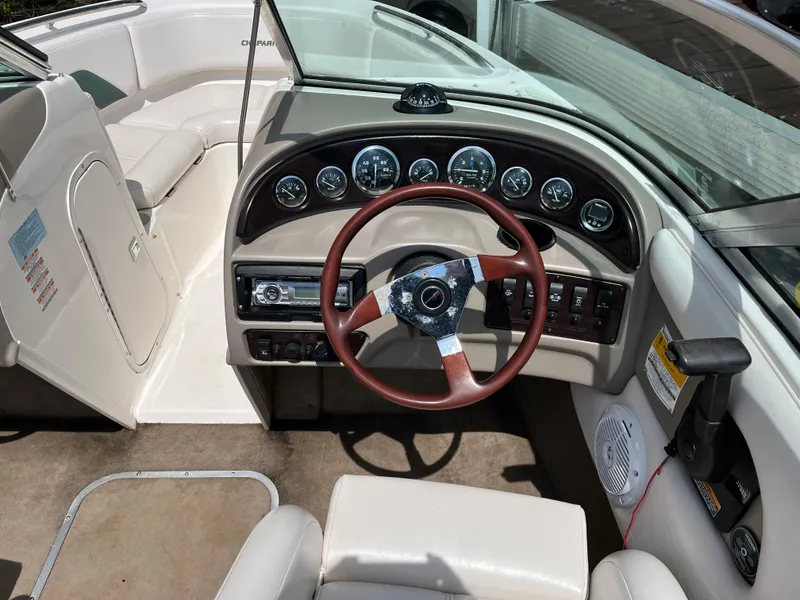 Slide: The Image of Interior of a 1999 Chaparral 1930 SS boat with steering wheel and dashboard controls. - 4