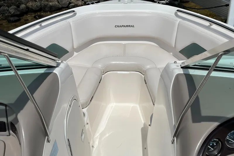 Slide: The Image of Interior view of 1999 Chaparral 1930 SS boat with white seating and sleek design. - 7