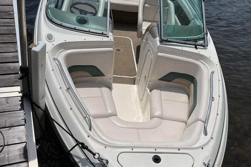 Slide: The Image of Chaparral 1930 SS boat, 1999 model, docked with white seating and open windshield. - 8