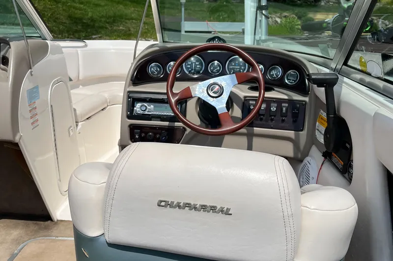 Slide: The Image of Interior of a 1999 Chaparral 1930 SS boat with steering wheel and dashboard. - 9