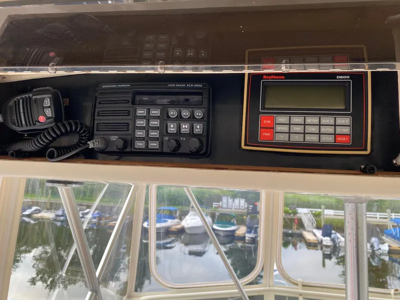 Slide: The Image of Control panel of a 1986 Viking 35 Convertible boat with radio and navigation equipment. - 16