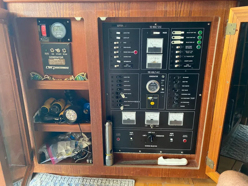 Slide: The Image of Electrical panel of a 1986 Viking 35 Convertible boat with various controls and meters. - 18