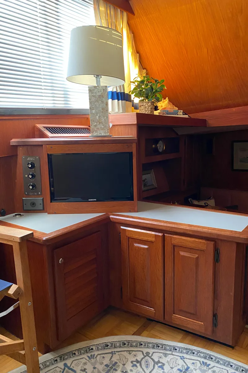 Slide: The Image of Interior of 1986 Viking 35 Convertible yacht with wood cabinetry and modern amenities. - 21