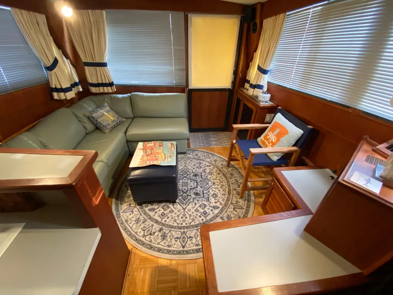 Slide: The Image of Interior of 1986 Viking 35 Convertible yacht with cozy seating and nautical decor. - 22