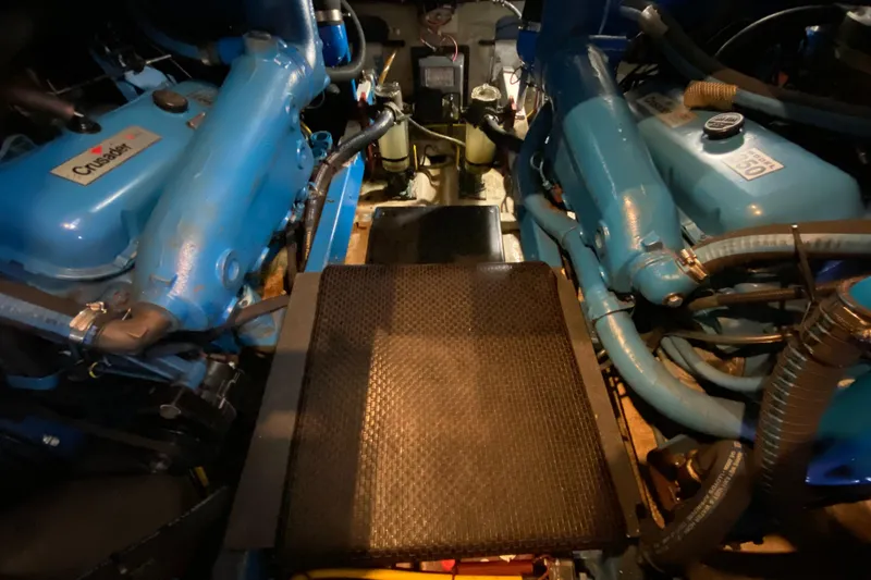Slide: The Image of Engine room of a 1986 Viking 35 Convertible with blue Crusader engines. - 31
