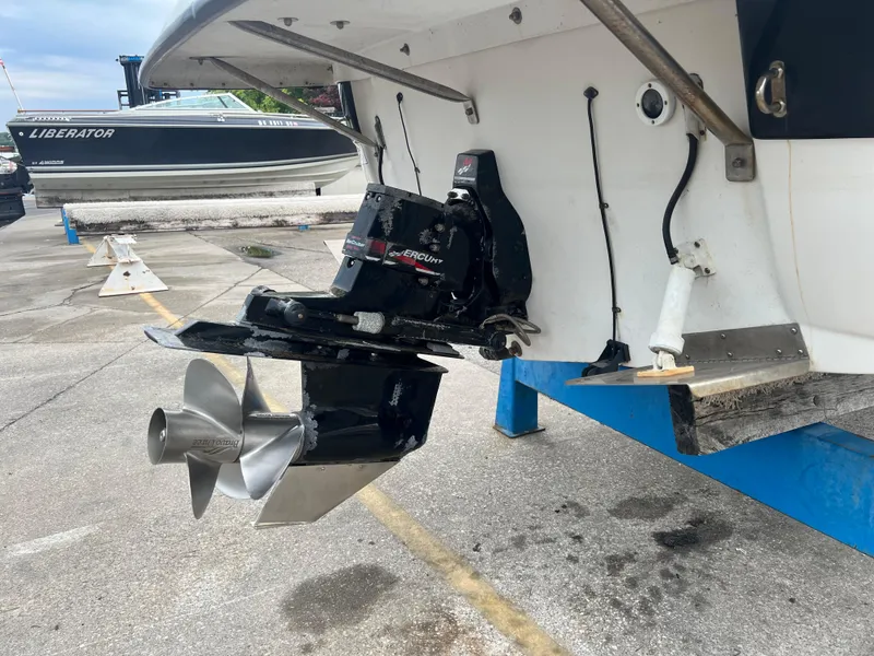 Slide: The Image of Rear view of a 2000 Crownline 242 CR boat with visible propeller and outdrive. - 4