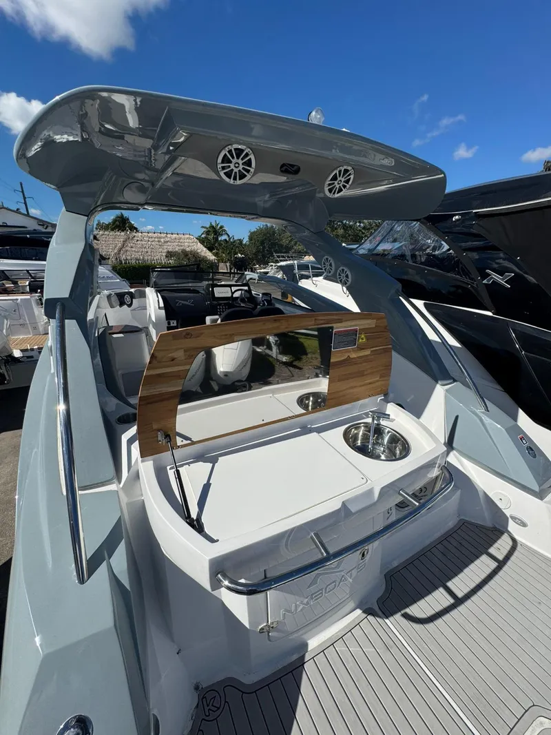 Slide: The Image of 2025 NX Boats NX280 XTREME luxury boat interior with sleek design and modern amenities. - 10