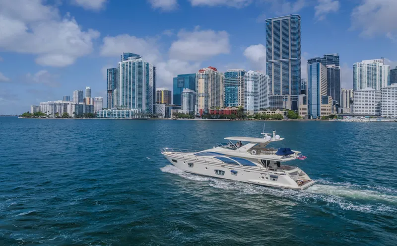 Slide: The Image of Azimut Flybridge 2008 yacht cruising near city skyline on a sunny day. - 28