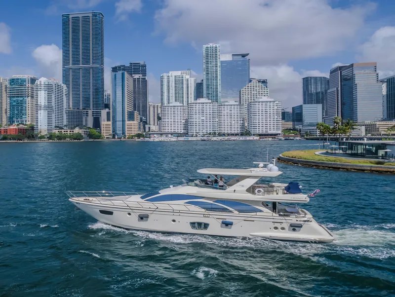 Slide: The Image of Azimut Flybridge 2008 yacht cruising near a city skyline with skyscrapers and blue sky. - 29