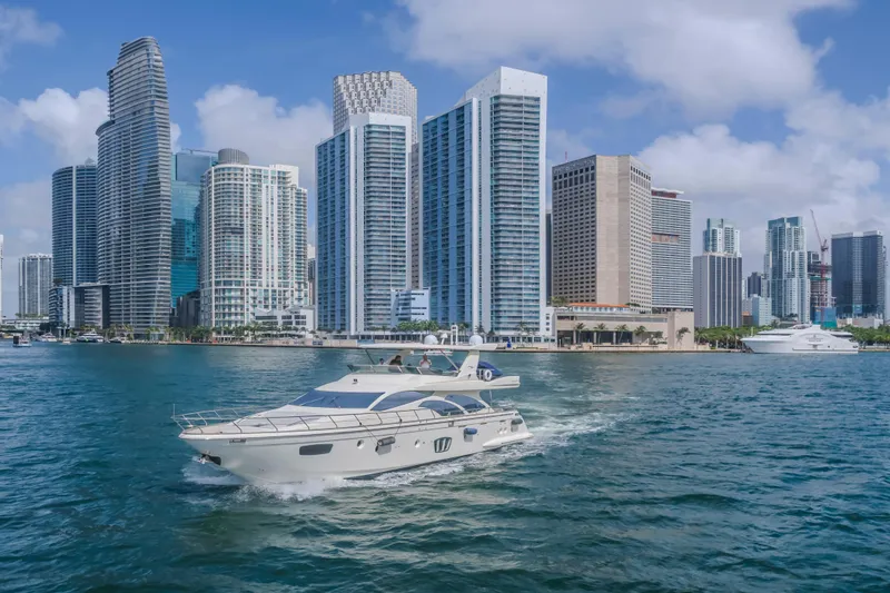 Slide: The Image of Azimut Flybridge 2008 yacht cruising near modern city skyline on a sunny day. - 39