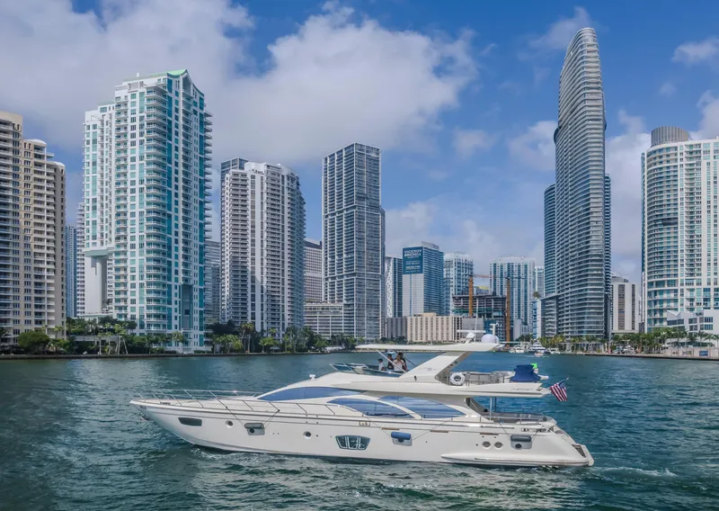 Slide: The Image of 2008 Azimut Flybridge yacht cruising near modern city skyline. - 42
