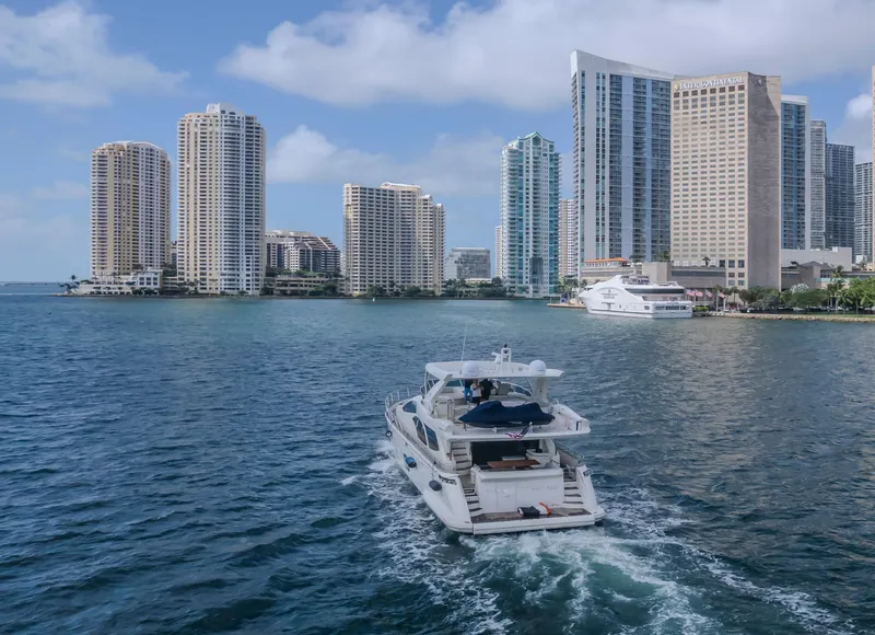 Slide: The Image of Azimut Flybridge 2008 yacht cruising near city skyline and waterfront buildings. - 46