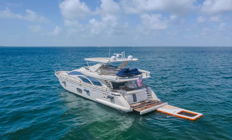 Slide: The Image of 2008 Azimut Flybridge yacht on open sea under blue sky. - 5