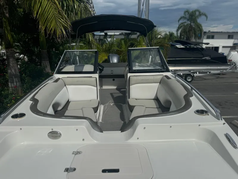 Slide: The Image of 2017 Starcraft 230 OB SCX EXT boat with spacious seating and sleek design. - 12