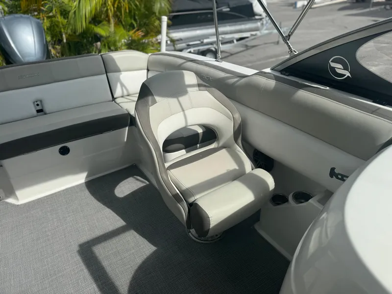 Slide: The Image of 2017 Starcraft 230 OB SCX EXT boat interior with seating and cup holders. - 16