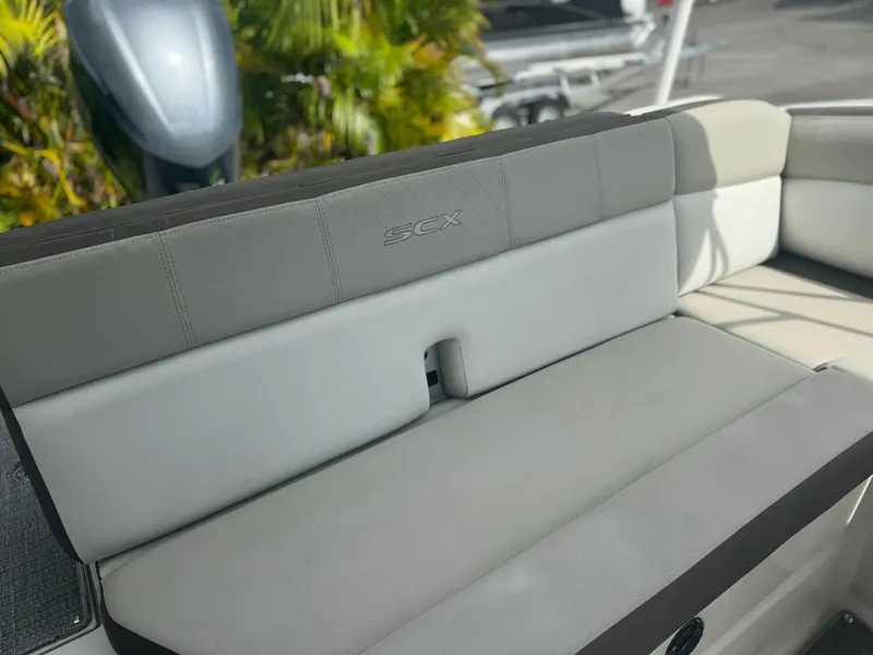 Slide: The Image of 2017 Starcraft 230 OB SCX EXT boat interior seating with gray upholstery. - 24