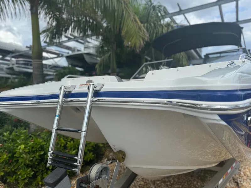 Slide: The Image of 2017 Starcraft 230 OB SCX EXT boat with ladder, parked outdoors. - 4