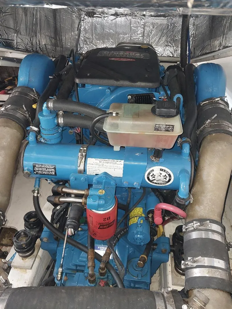 Slide: The Image of Engine compartment of a 2006 Tiara Yachts 2900 Coronet, showcasing detailed mechanical components. - 12