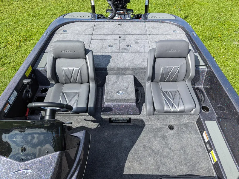 Slide: The Image of 2026 Falcon F215 boat interior with dual gray seats and steering wheel. - 12