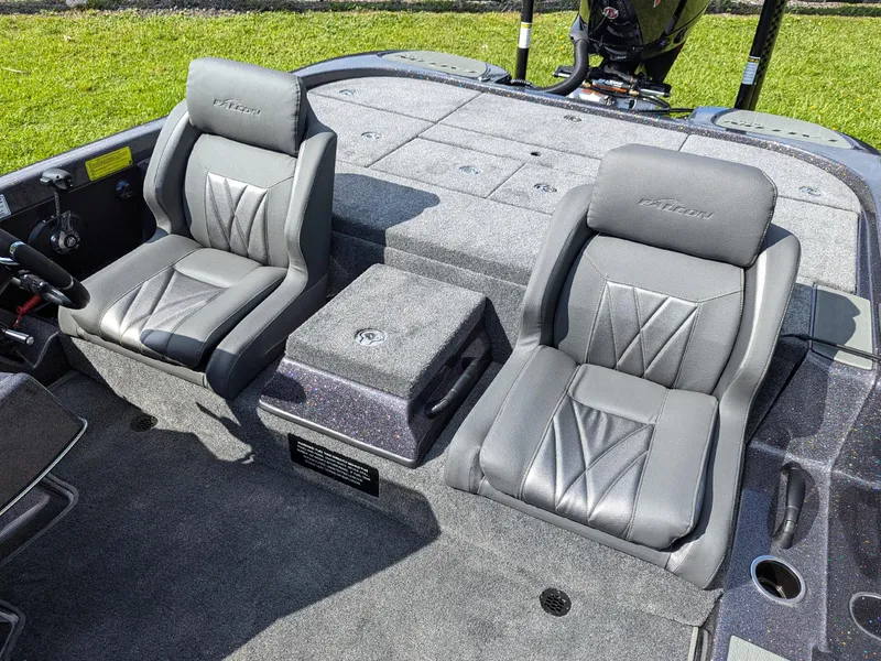 Slide: The Image of 2026 Falcon F215 boat interior with two gray leather seats and steering wheel. - 13