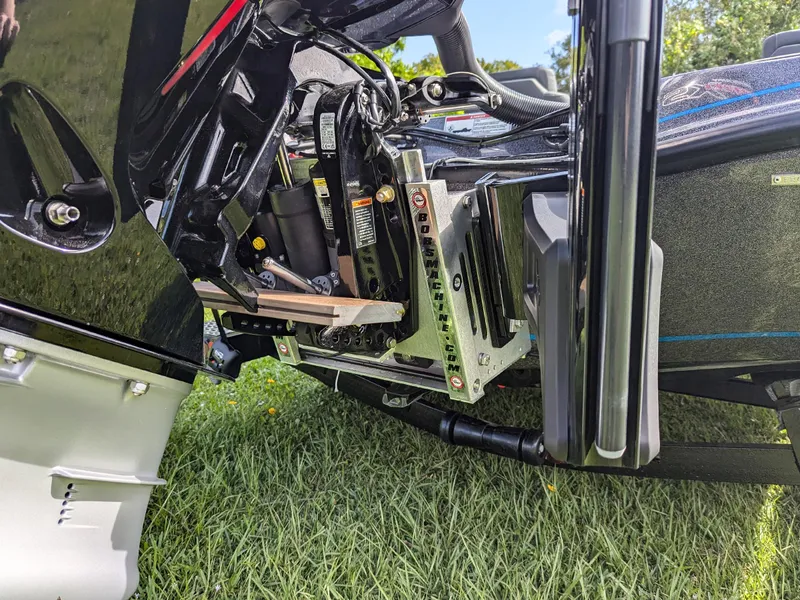 Slide: The Image of Close-up of a 2026 Falcon F215 boat engine mount on grass. - 14