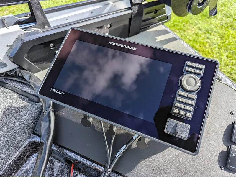 Slide: The Image of Humminbird XPLORE 9 fishfinder on Falcon F215 boat, 2026 model, with control panel. - 16
