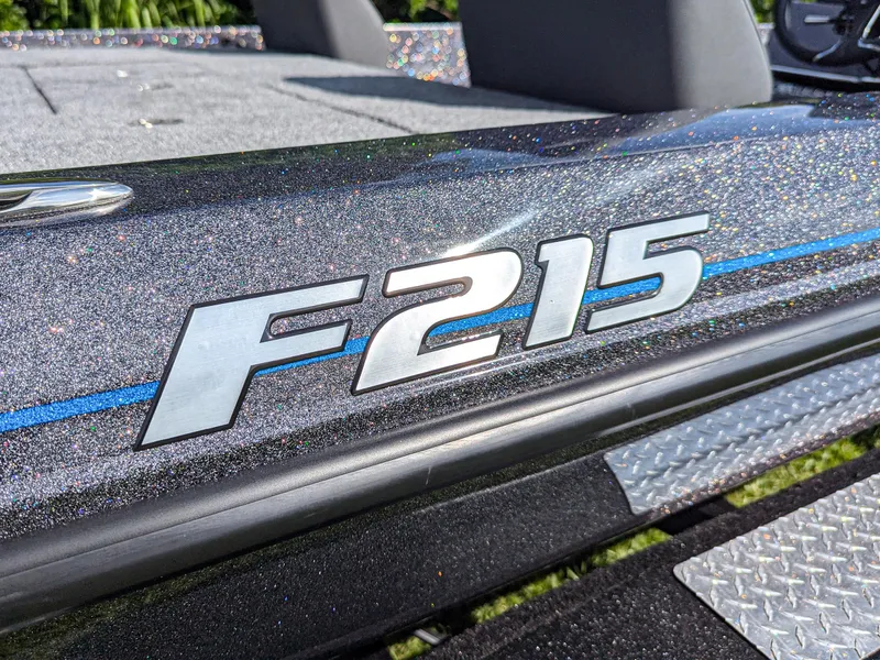 Slide: The Image of 2026 Falcon F215 boat with glittery finish and blue accent stripe. - 18