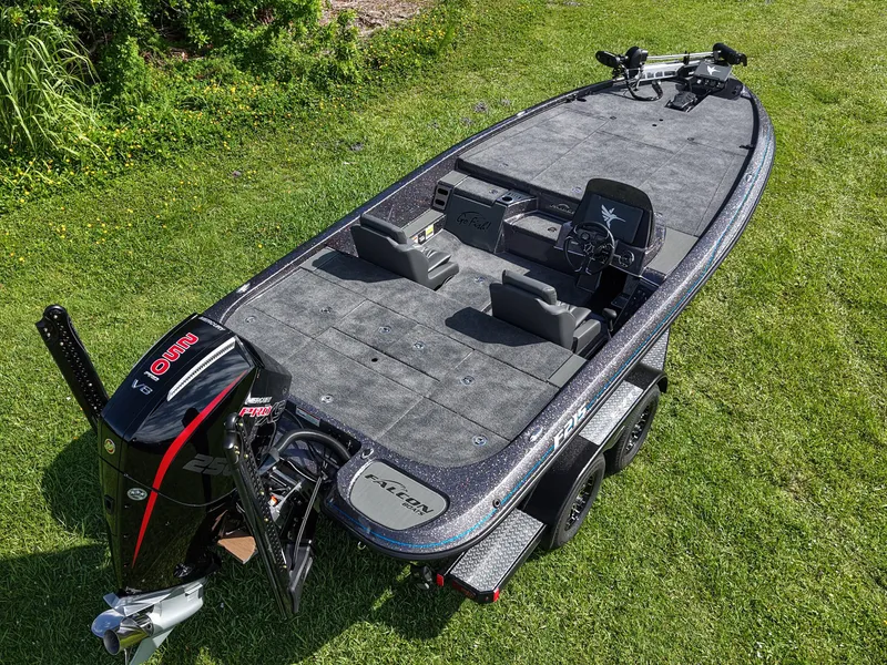 Slide: The Image of 2026 Falcon F215 boat on grass, featuring spacious deck and powerful engine. - 6
