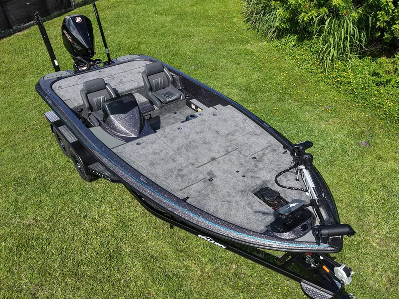 Slide: The Image of 2026 Falcon F215 boat on grass, featuring dual seats and a sleek design. - 7