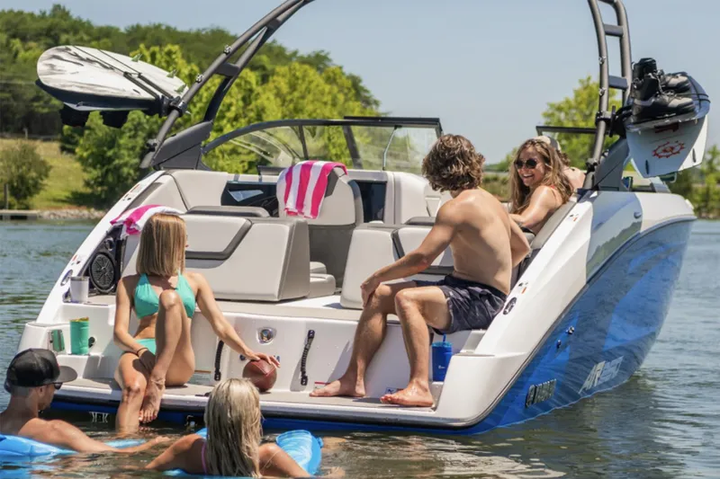 Slide: The Image of Yamaha AR250 2025 boat table with cup holders and champagne glasses. - 3