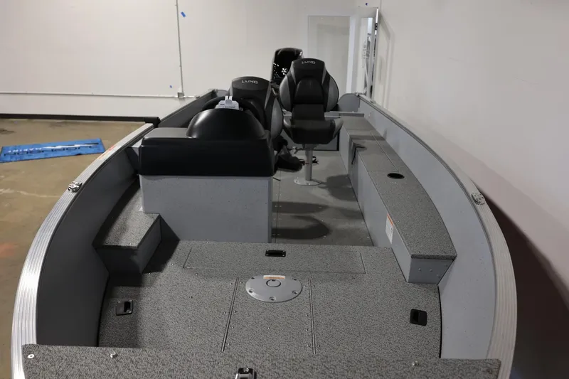 Slide: The Image of 2025 Lund 1600 Fury SS boat interior with seating and storage compartments. - 7